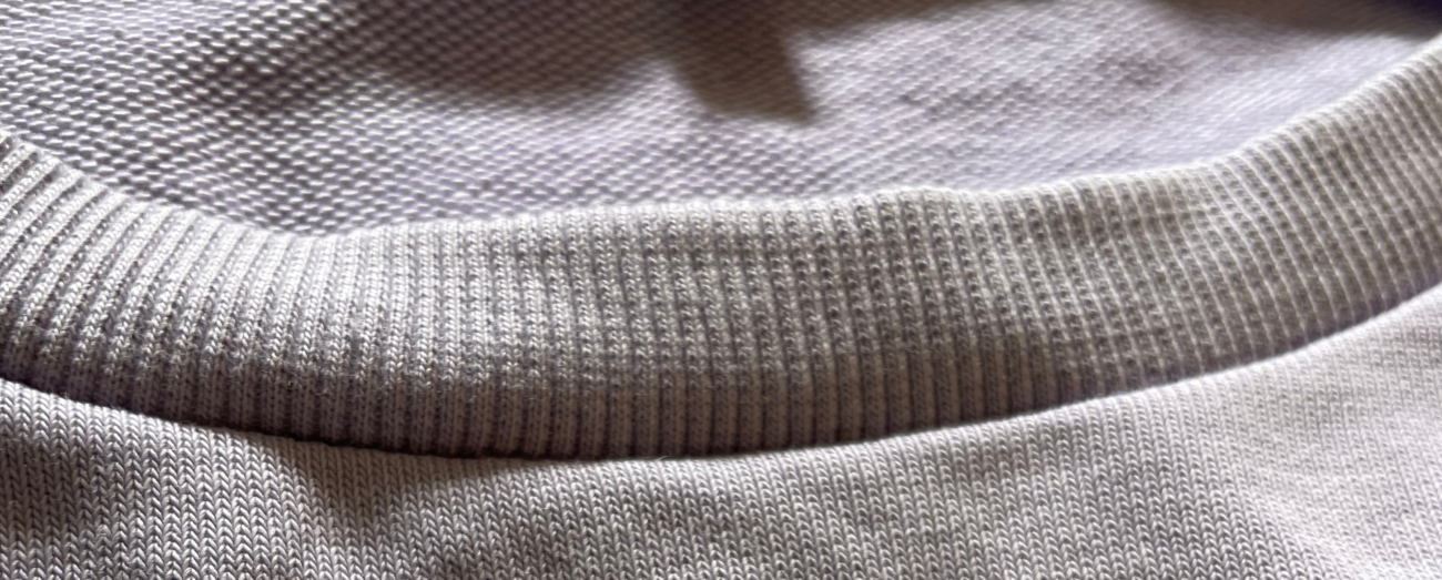 "Close-up of soft terry fiber fabric, showcasing its textured and breathable material, used in Zeal Store's oversized t-shirts for ultimate comfort and durability."